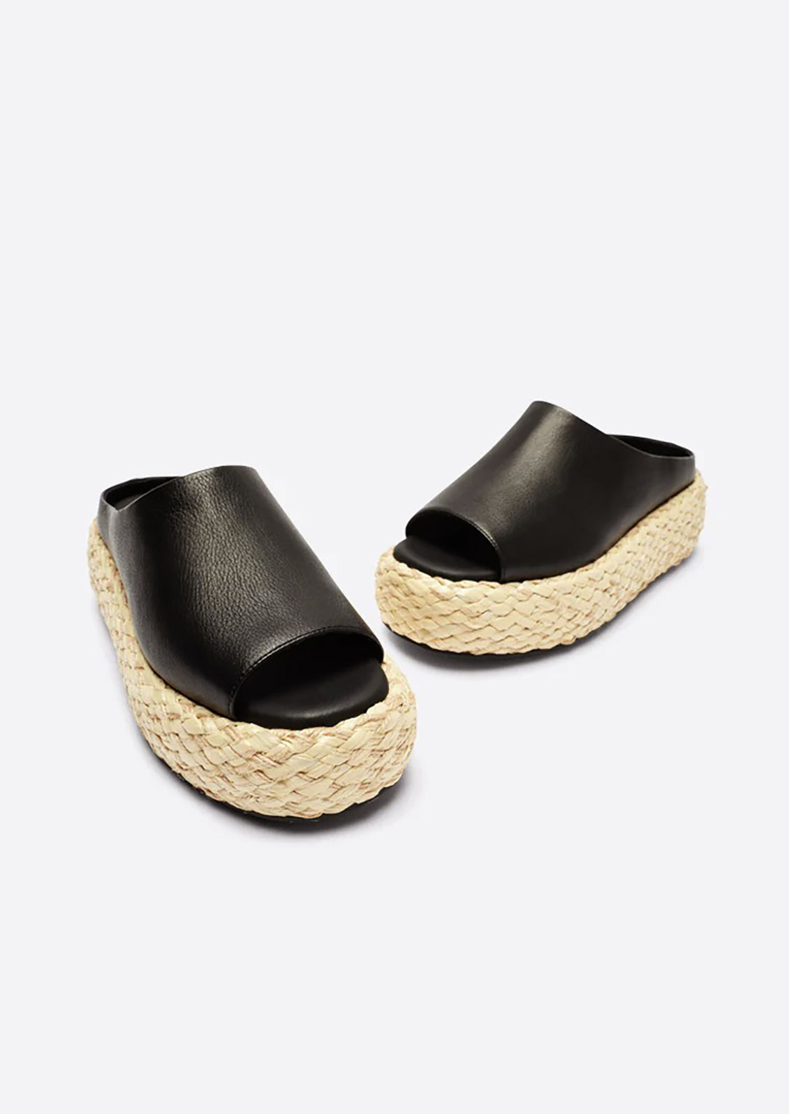 A pair of leather platform sandals with espadrille sole in black.