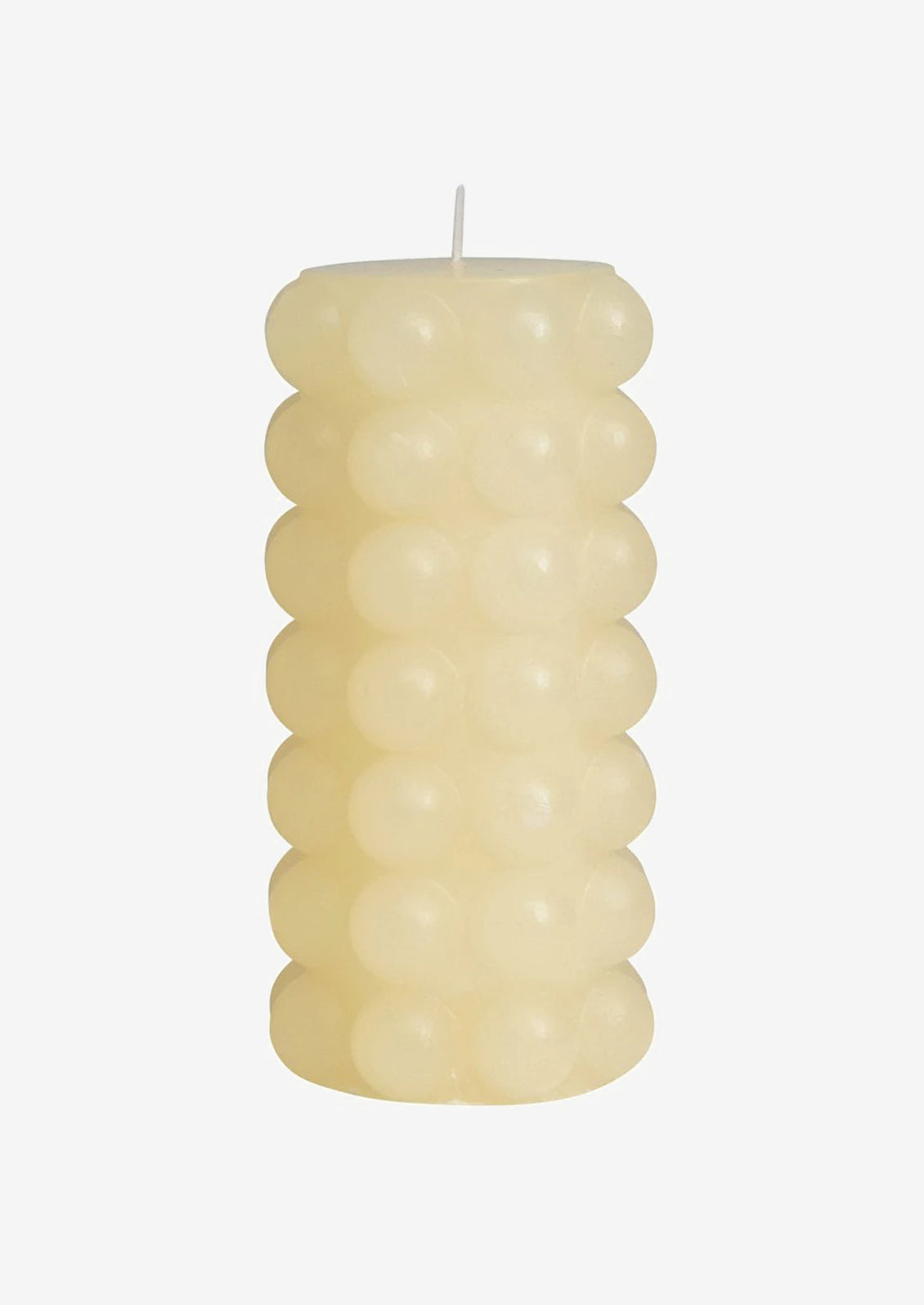 A buttermilk colored hobnail texture pillar candle in tall.