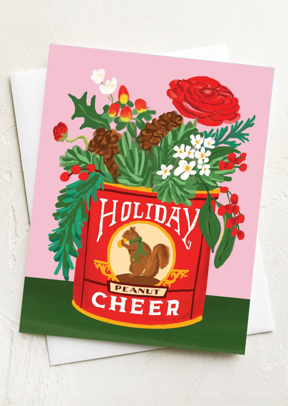 A holiday greeting card with illustration of peanut tin holding festive holiday greenery.