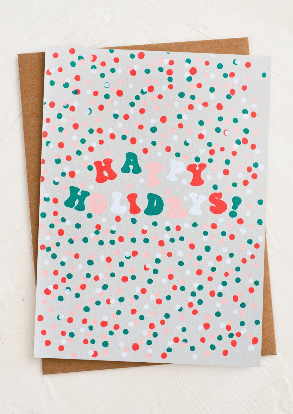 Greeting card with 'Happy Holidays!' text on a polka dot background