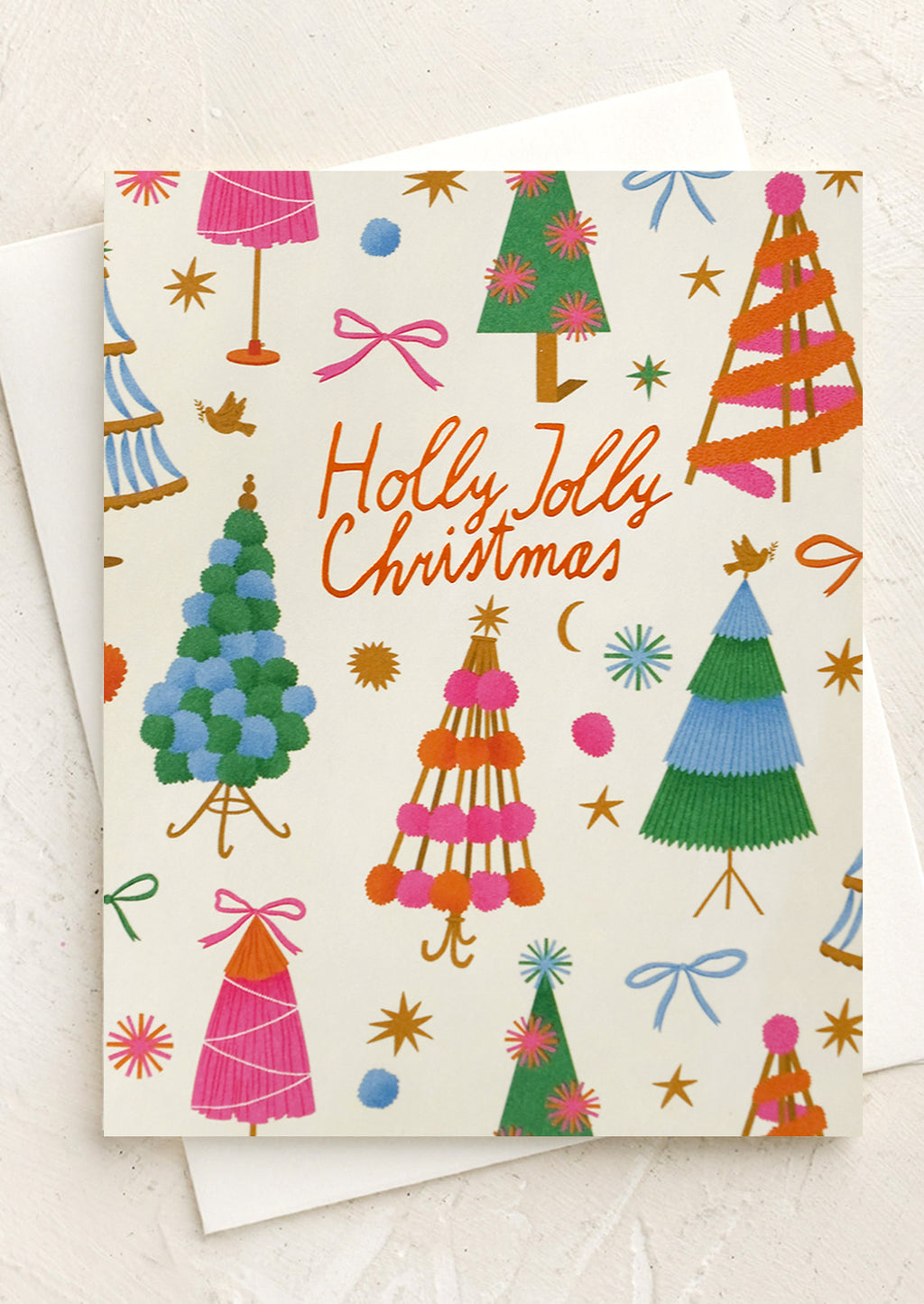 2: A colorful tree print card set reading "Holly jolly christmas".