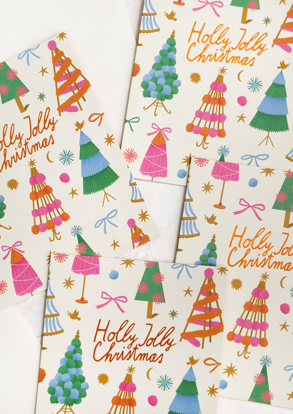 1: A colorful tree print card set reading "Holly jolly christmas".