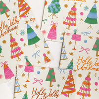 1: A colorful tree print card set reading "Holly jolly christmas".