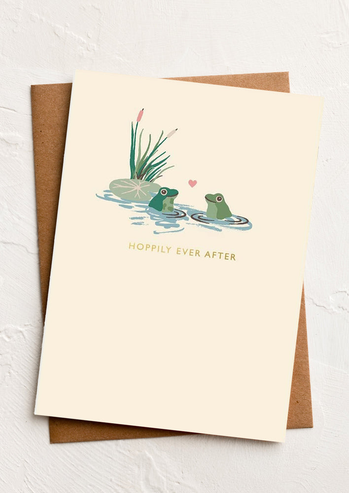 1: A frog print greeting card reading "Happily ever after".