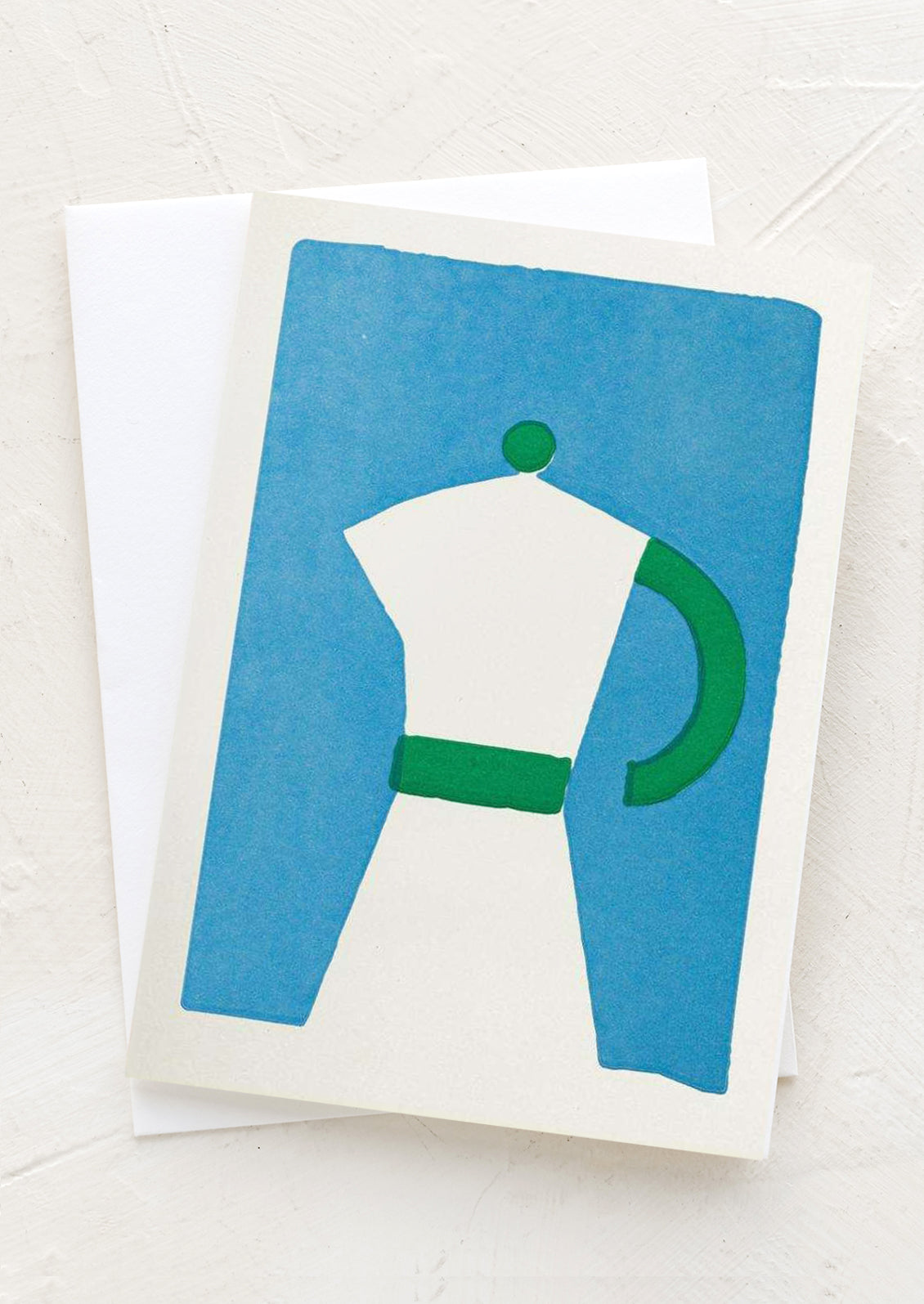 Greeting card with a white and green coffee pot design on a blue background