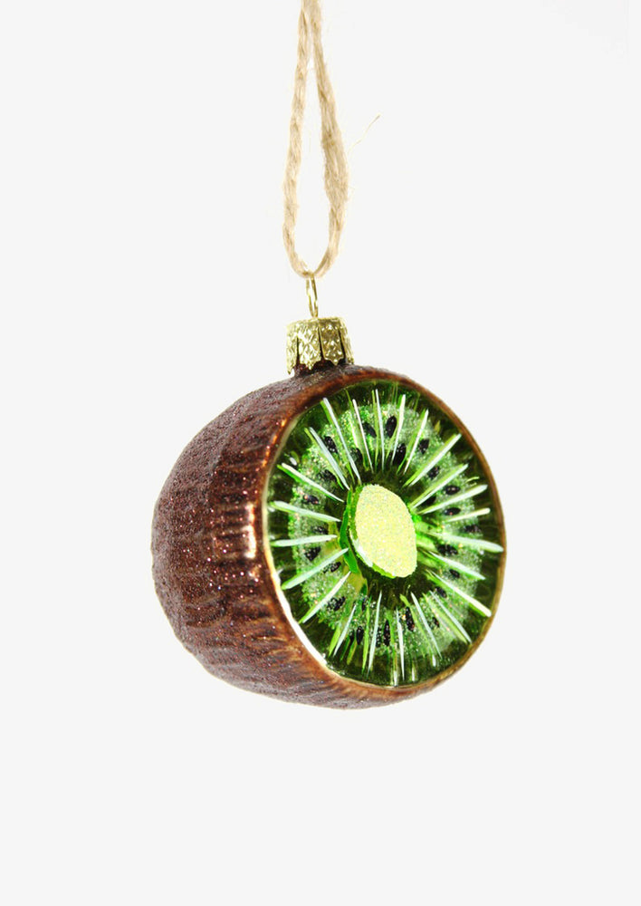 1: A glass ornament of a sliced kiwi.