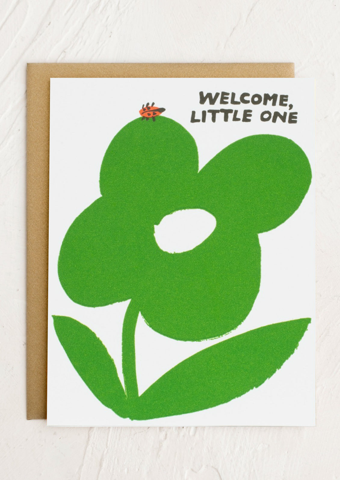 A card with image of ladybug on flower, text reads "Welcome, little one".