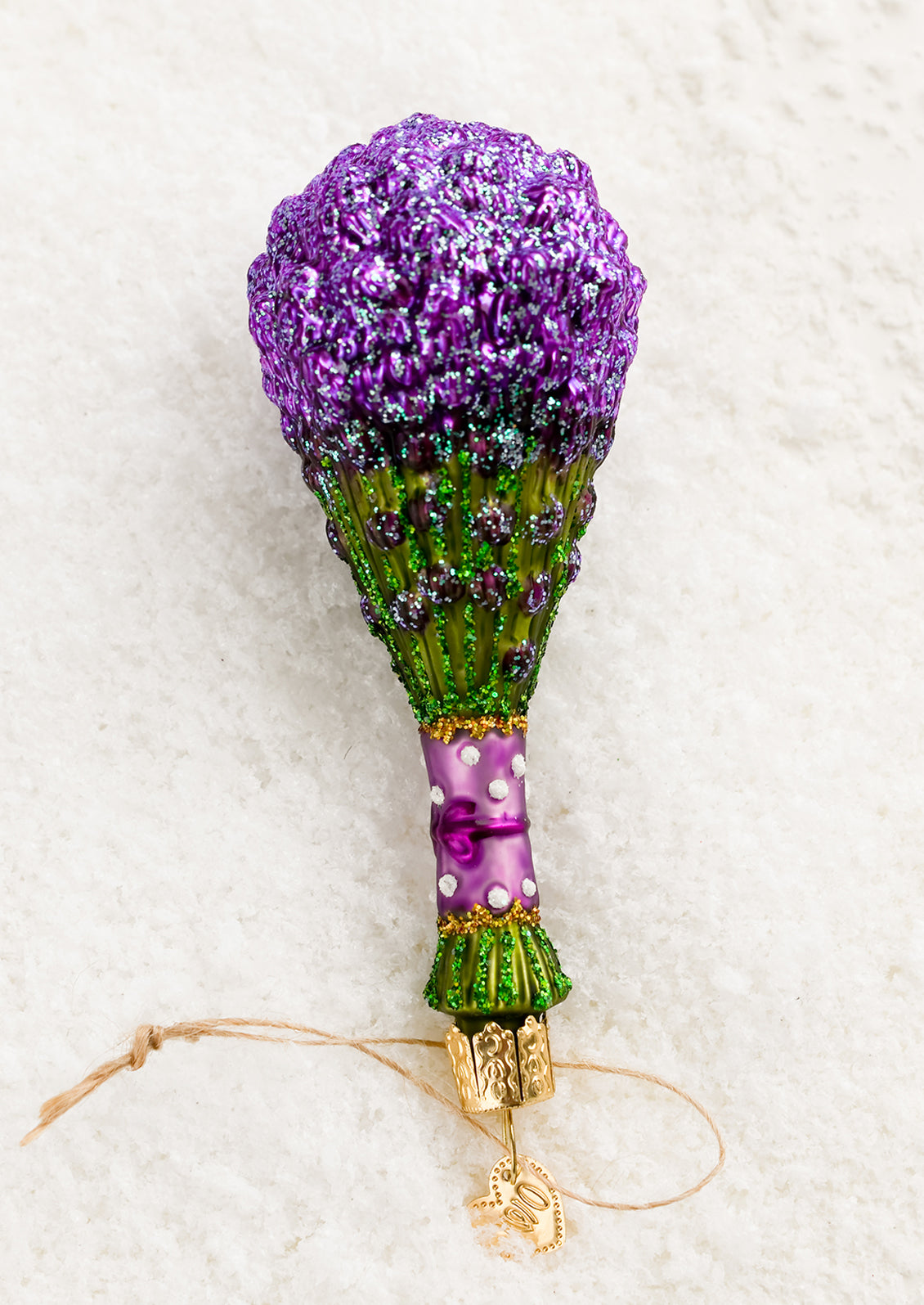 A glass holiday ornament of a bushel of lavender.
