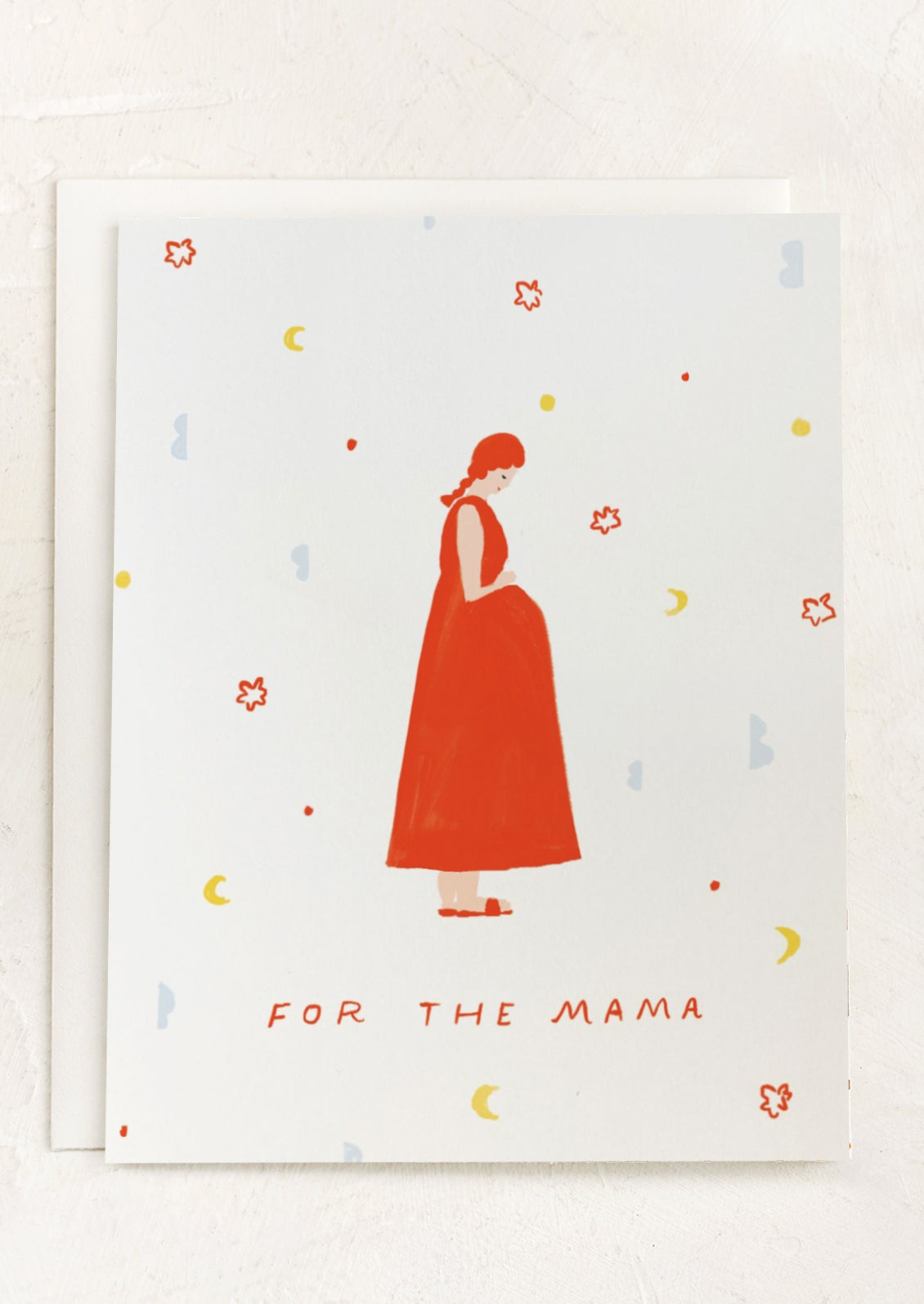 A greeting card with illustration of a pregnant mother in a red dress; text reads "For the mama".