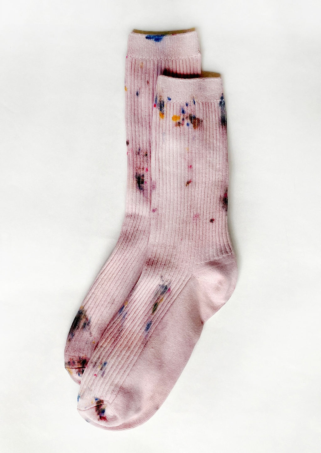 Maplewood: A pair of tie dye socks in dusty pink color.