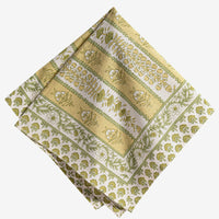 3: A set of green and yellow floral print napkins.