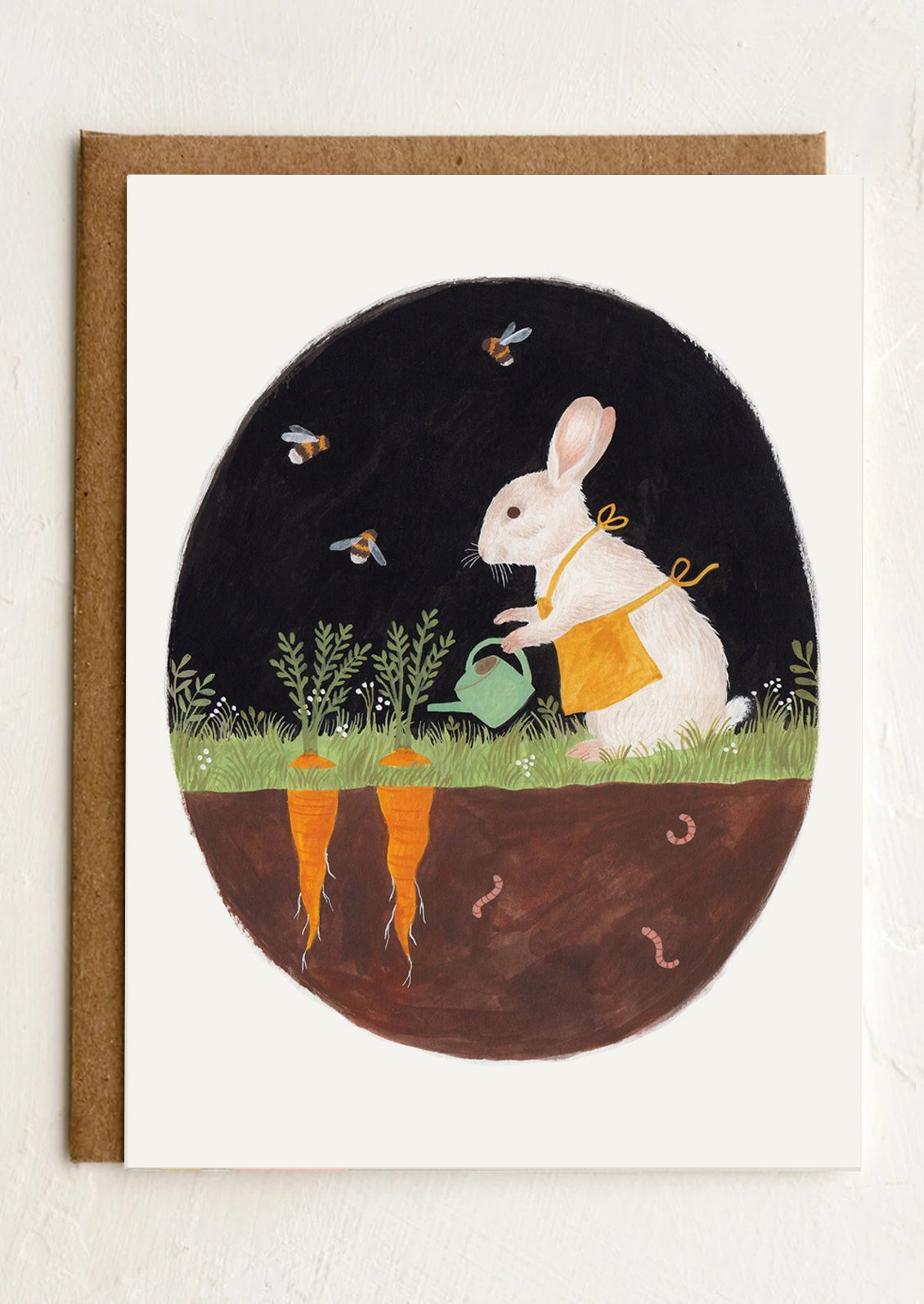 A greeting card with illustration of a rabbit gardening at night.