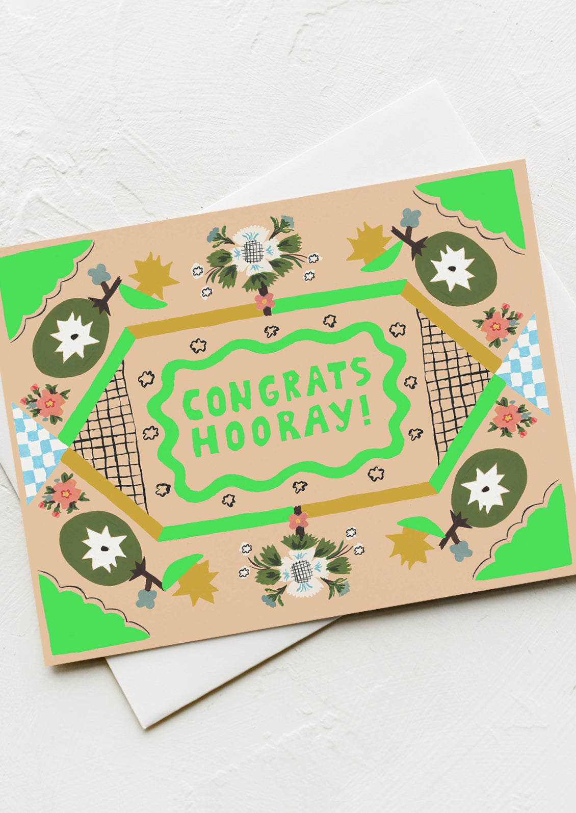 A greeting card with modern quilt-like pattern, neon green text at center reads "Congrats Hooray!".