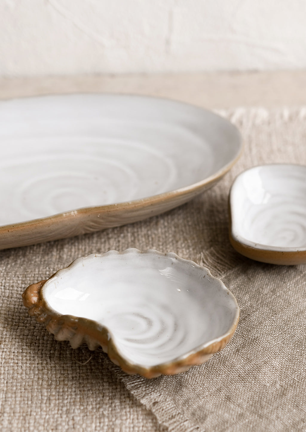 1: Ceramic serving dishes that look like shells.