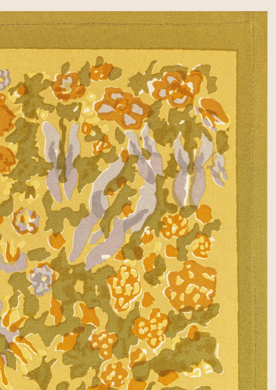 A mustard floral print placemat.