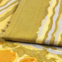2: A mustard floral print table runner.