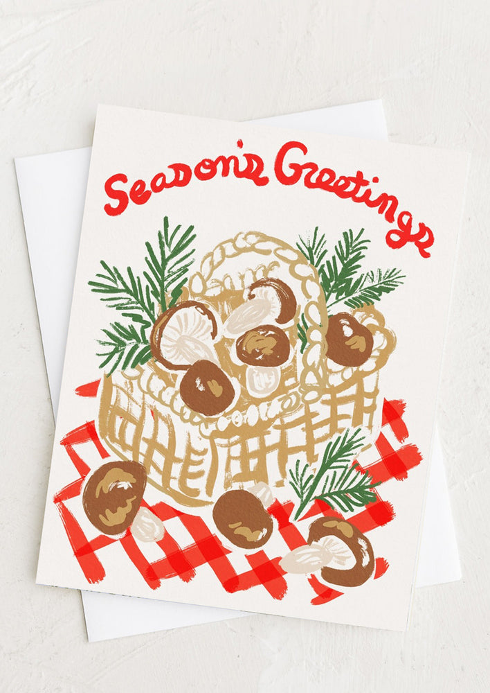 1: A seasonal greeting card with illustration of mushrooms in a basket.