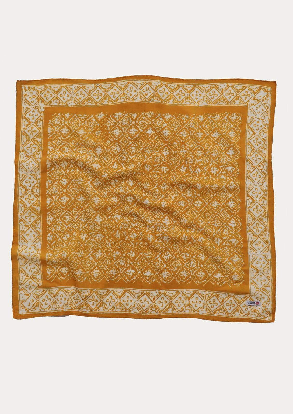 Yellow patterned square fabric scarf.
