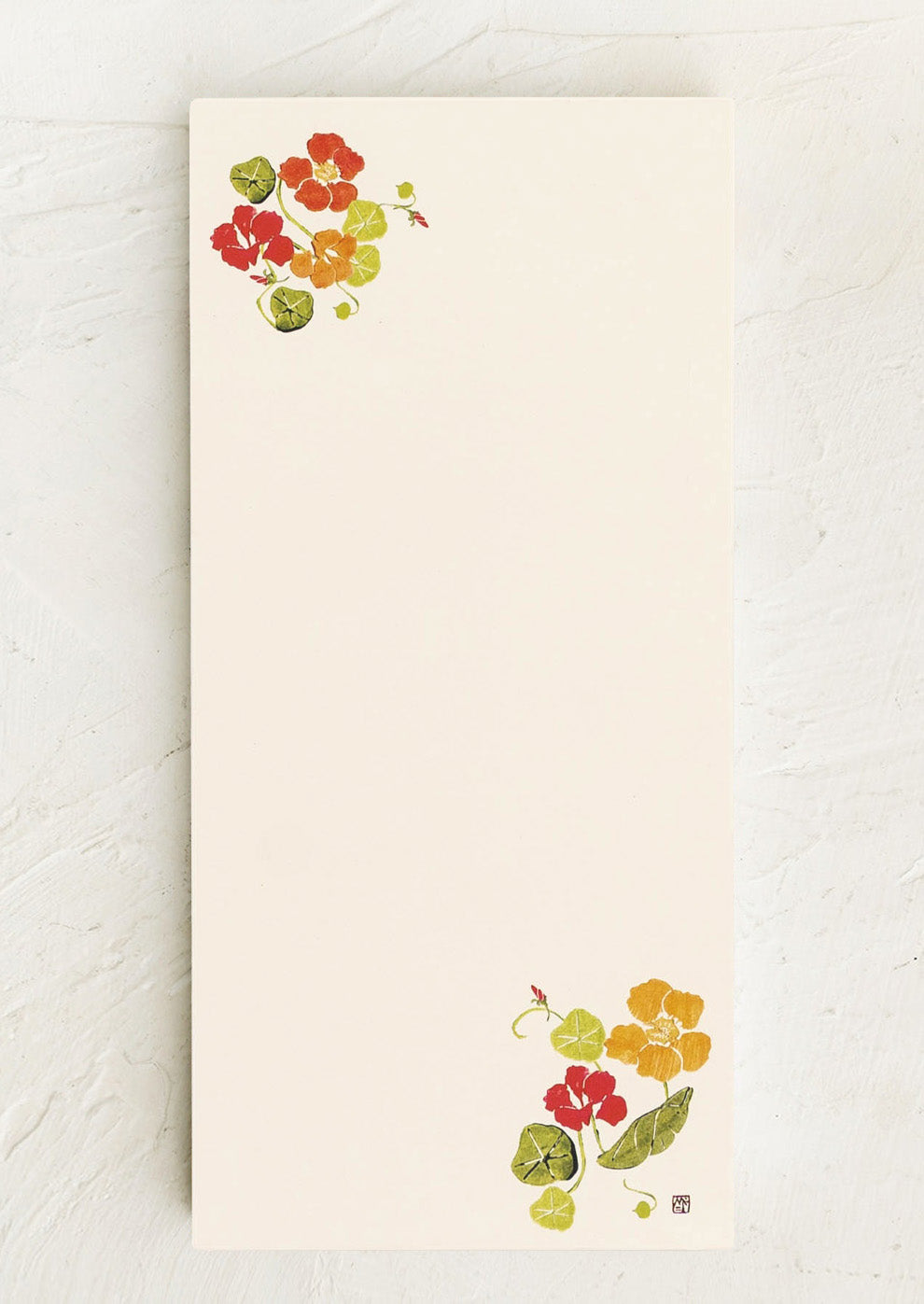 Notepad with nasturtium flower illustrations on a white background