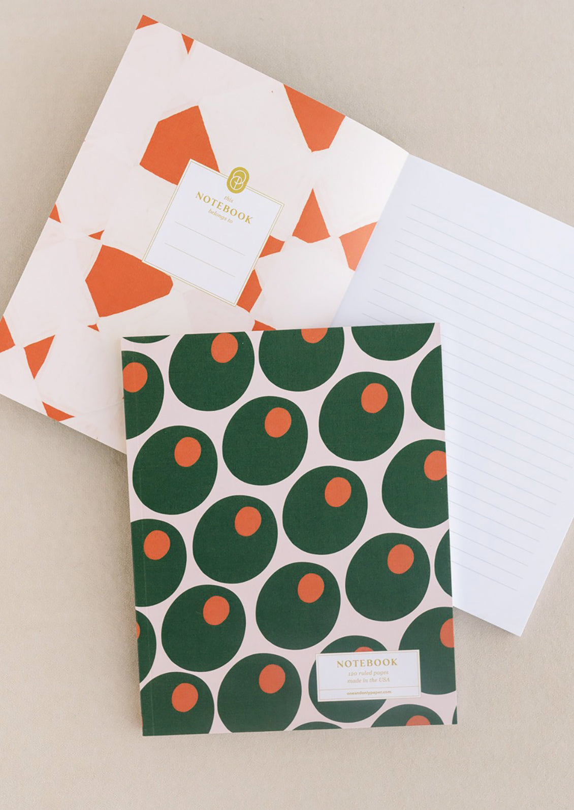 A ruled journal with allover olive print cover.