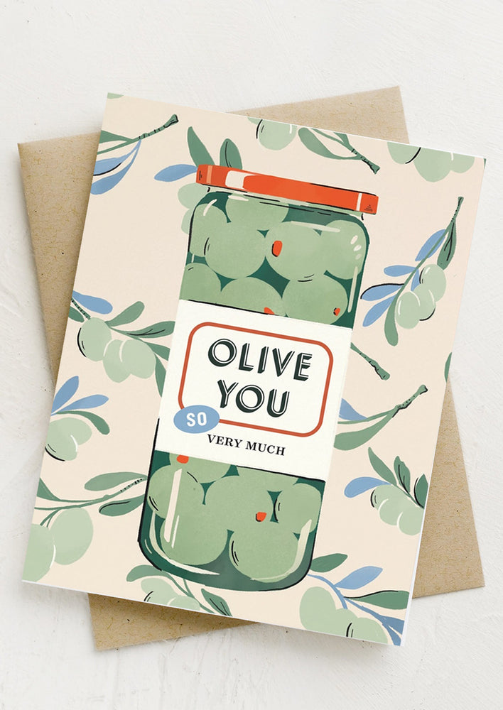 1: A card with image of jar of olives, text reads "Olive you so very much".