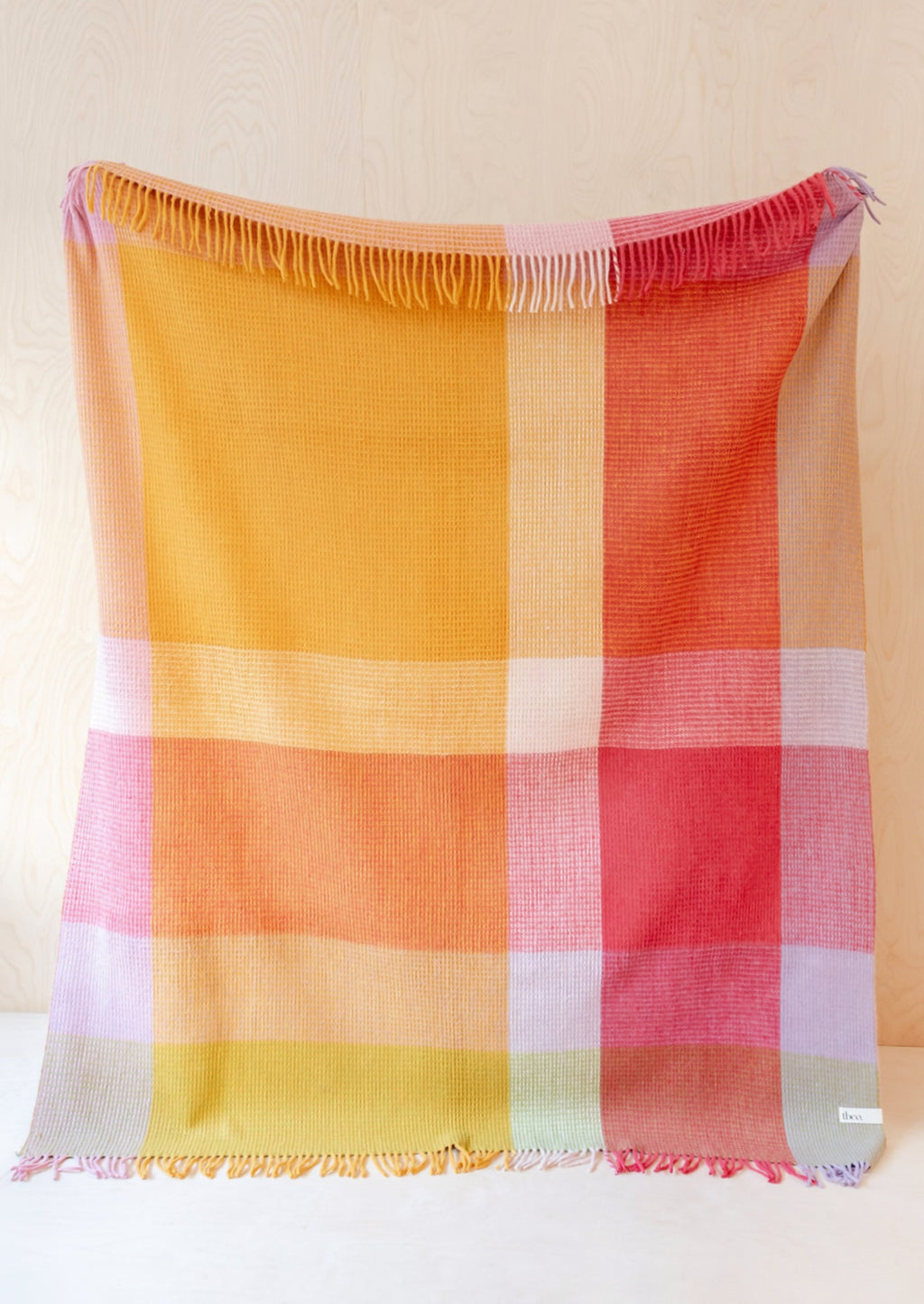 Orange Juice Multi: A colorblock large check patterned throw in magenta, orange, yellow and lavender tones.
