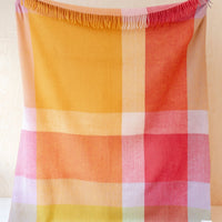 Orange Juice Multi: A colorblock large check patterned throw in magenta, orange, yellow and lavender tones.