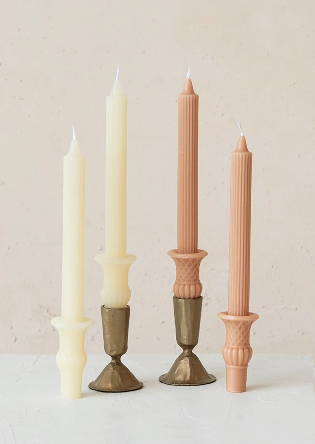 Ivory: Urn shaped taper candles in ivory and nectar colors.
