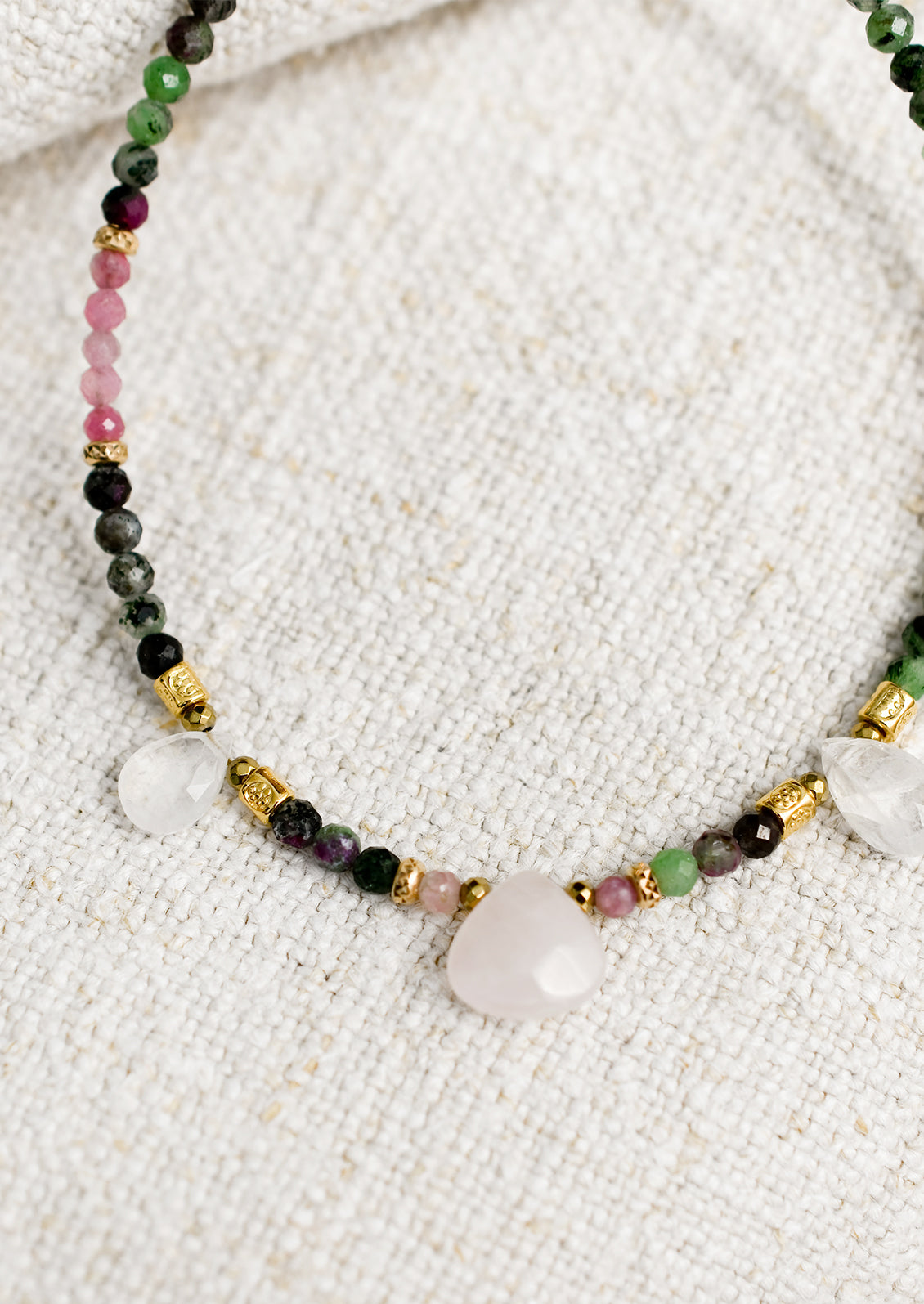 A beaded necklace made of moonstone and rubies.
