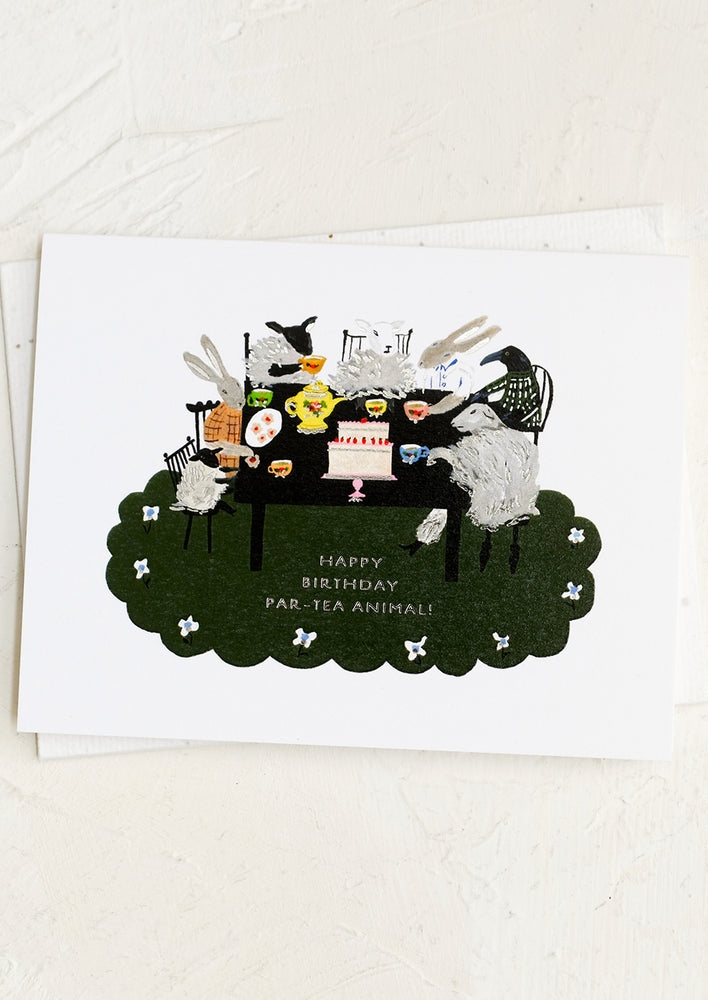 1: A birthday card showing animals having a tea party.