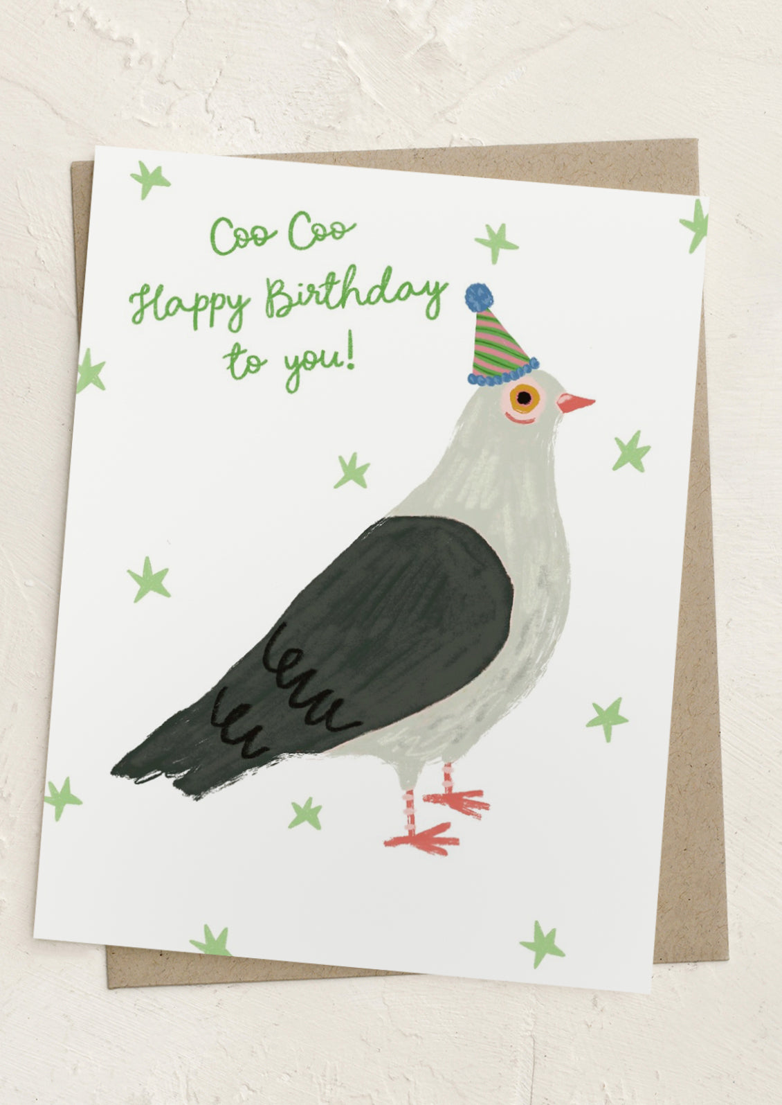 Birthday card with a pigeon wearing a party hat and text 'Coo Coo Happy Birthday to you!'.