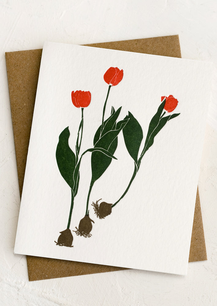 A greeting card with image of red tulips.