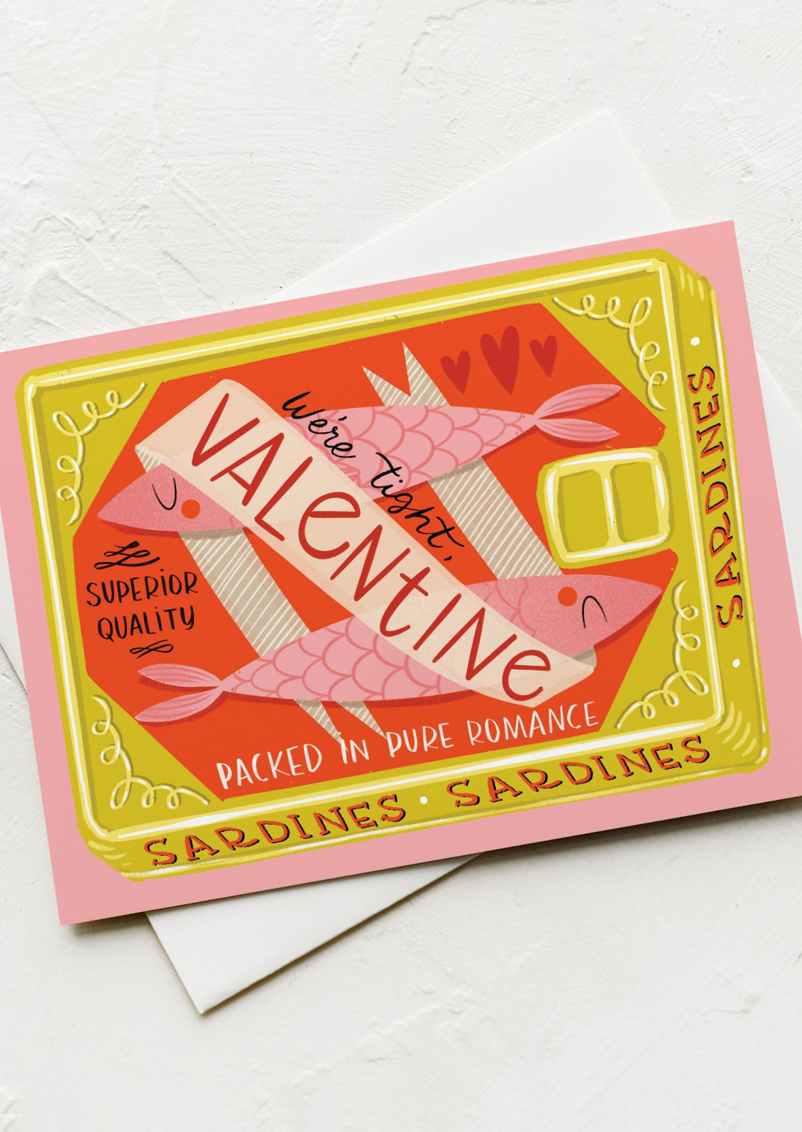 A card with illustration of sardines in tin, text reads "We're tight, Valentine".