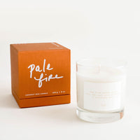Pale Fire: A glass candle with a white label sits next to a peach colored box reading "lost letters" in black cursive text.