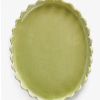 Meadow Green: A green ceramic oval tray with scalloped edges.