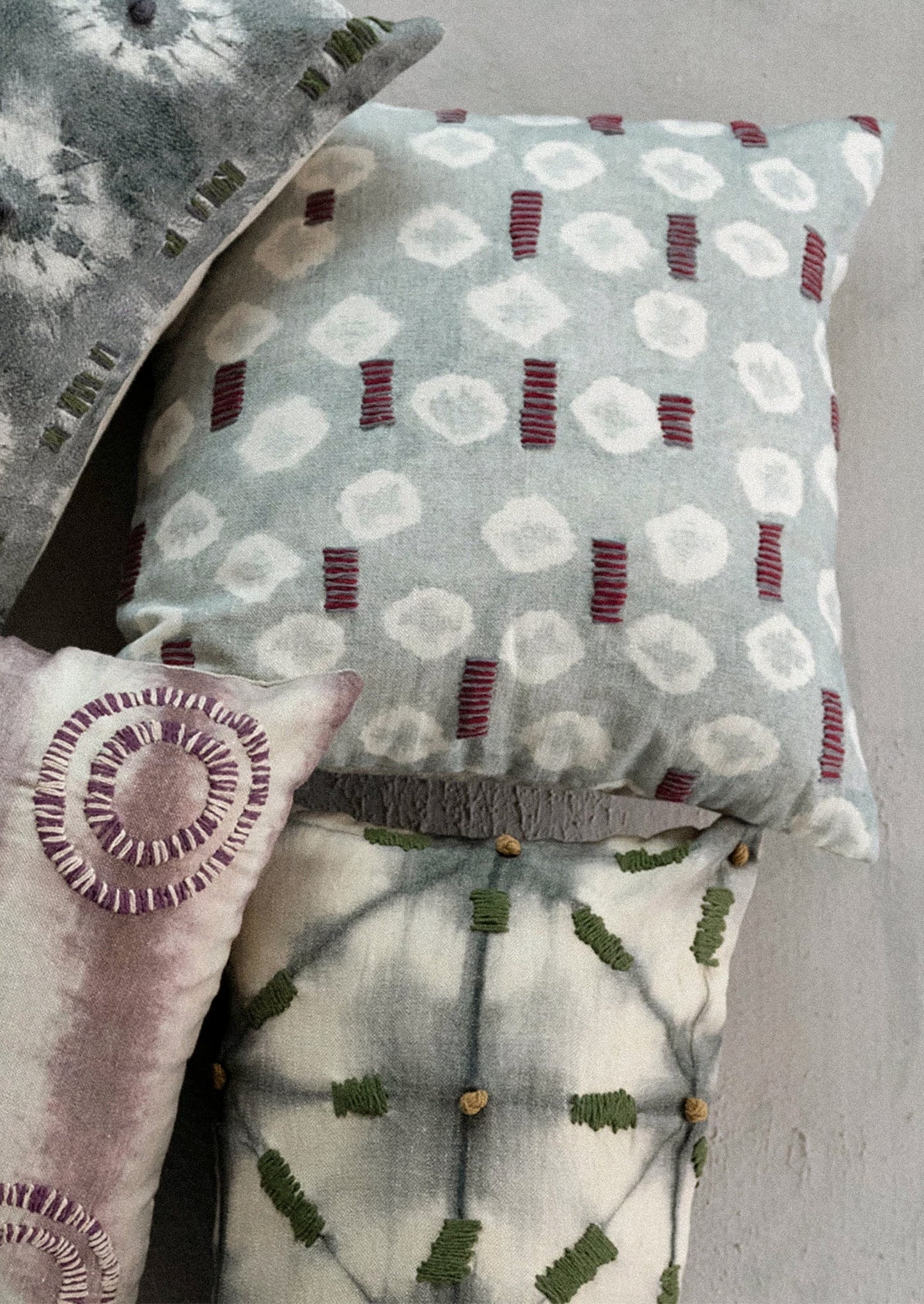 Assorted batik tie dye pillows.