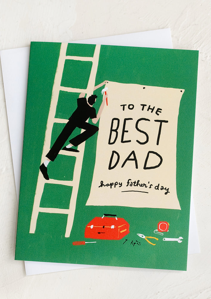 1: Green father's day card with sign and tools.
