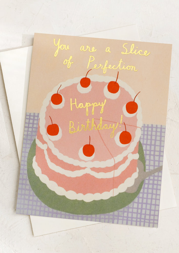 A card with illustration of layer cake, text reads "You are a slice of perfection - happy birthday".
