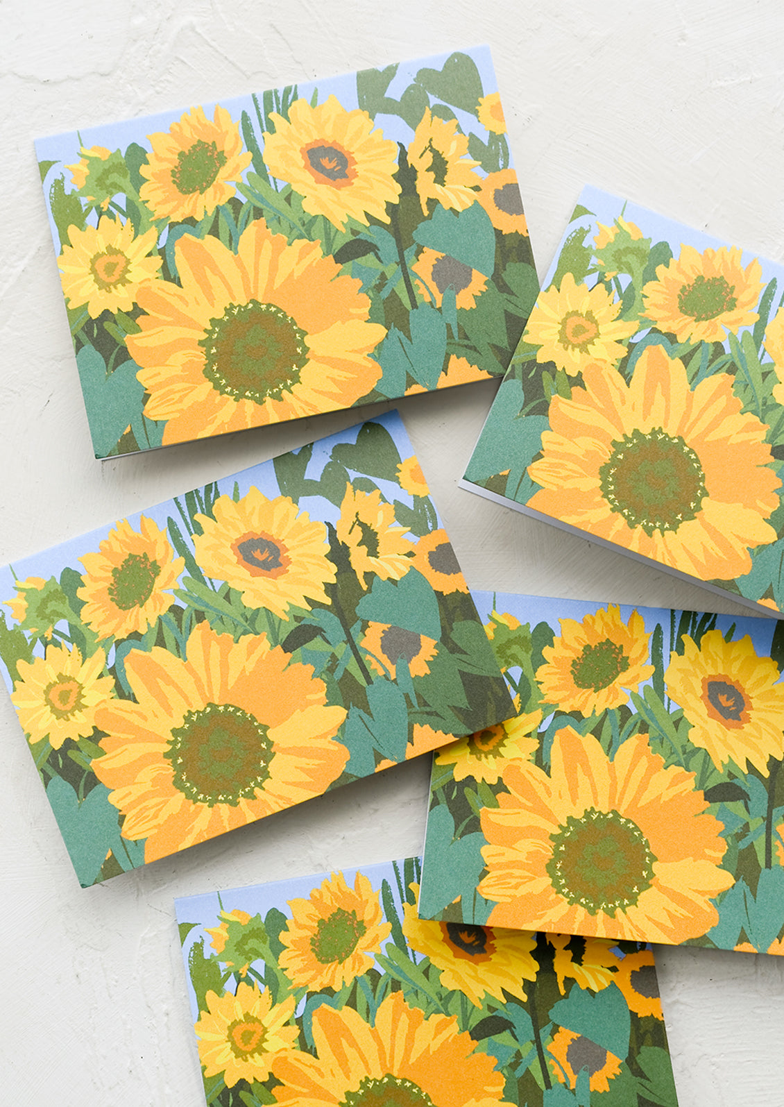 A set of yellow sunflower printed greeting cards.