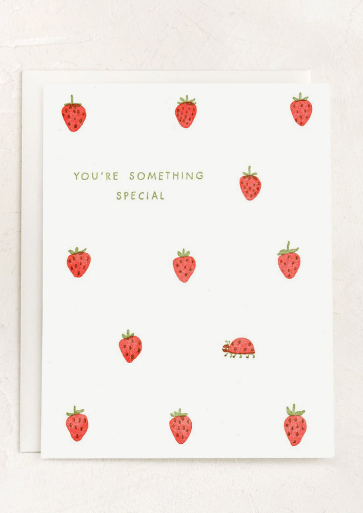 1: A card with single ladybug amid strawberries, text reads "You're something special".