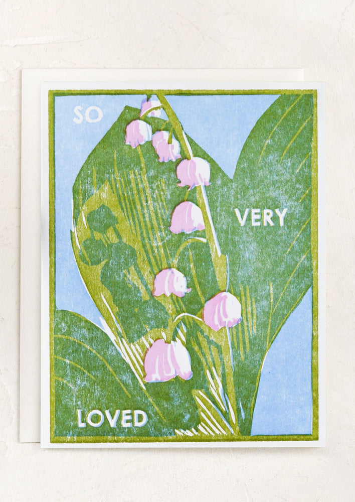 A lily of the valley print card reading "So very loved".