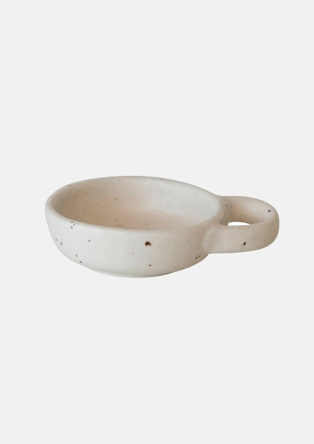 2: A small ceramic pinch bowl in speckled white ceramic with decorative handle.