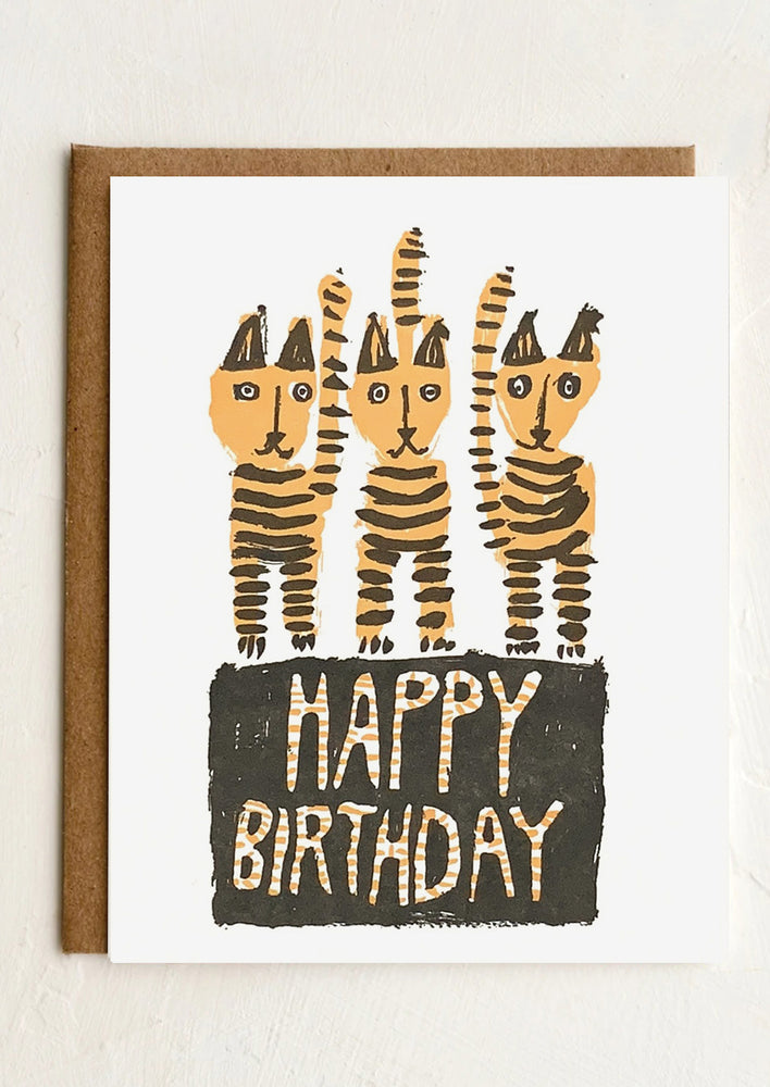 1: A greeting card with illustration of striped cats, text reads "Happy Birthday".