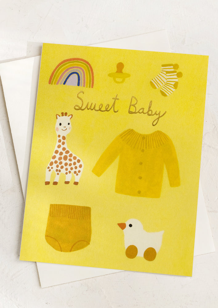 An illustrated greeting card in tones of yellow reading "Sweet baby".
