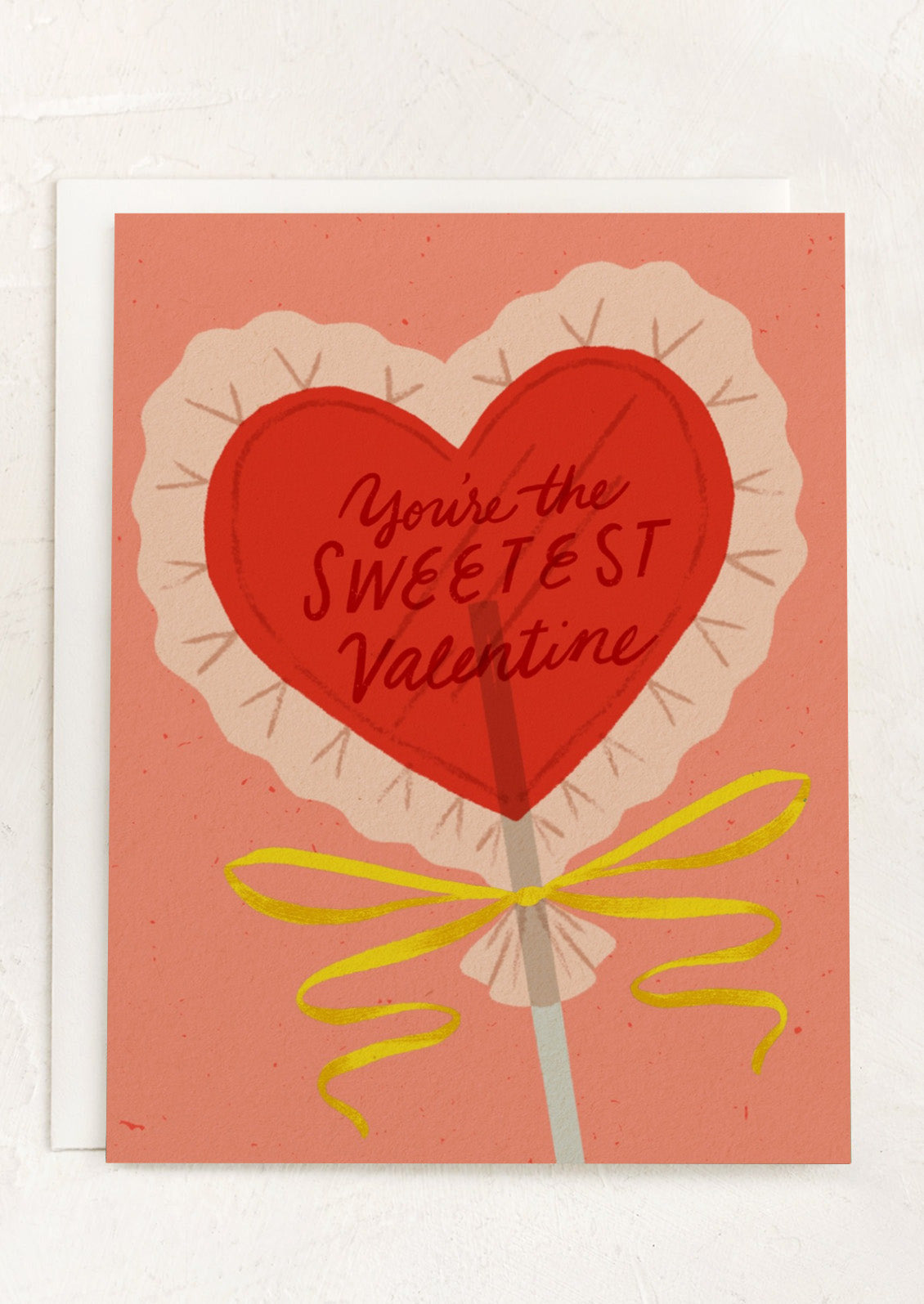 A card with illustration of heart-shaped lollipop, text reads "You're the Sweetest Valentine".