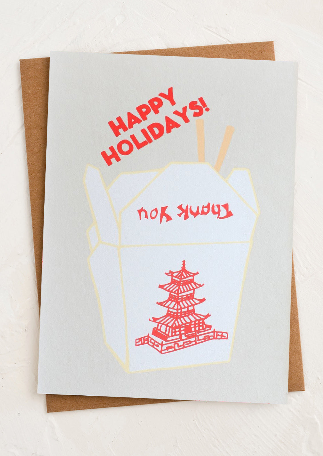Greeting card with 'Happy Holidays!' text next to illustration of Chinese food takeout container.