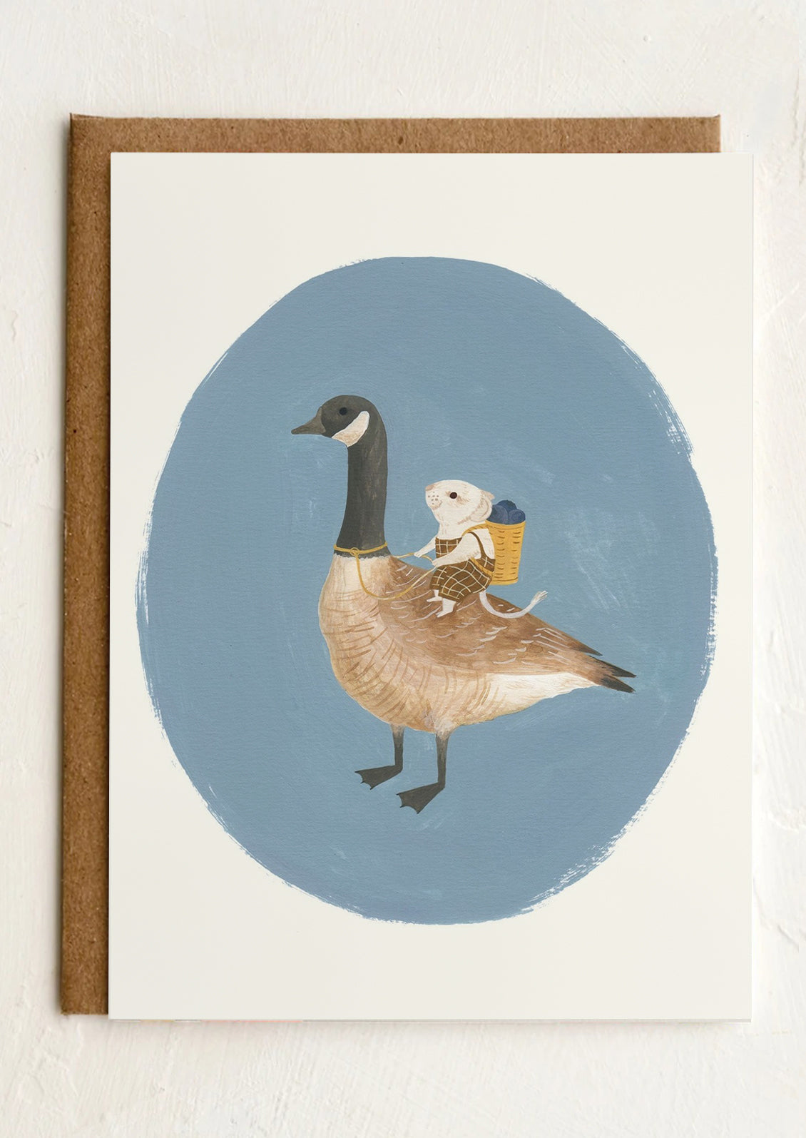A greeting card with illustration of a mouse travelling on goose's back.
