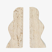 2: A pair of natural travertine bookends with wavy squiggle shape.