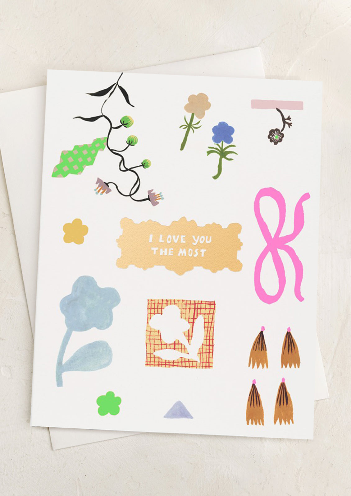 A card with illustration of playful bows and flowers, text reads "I love you the most".