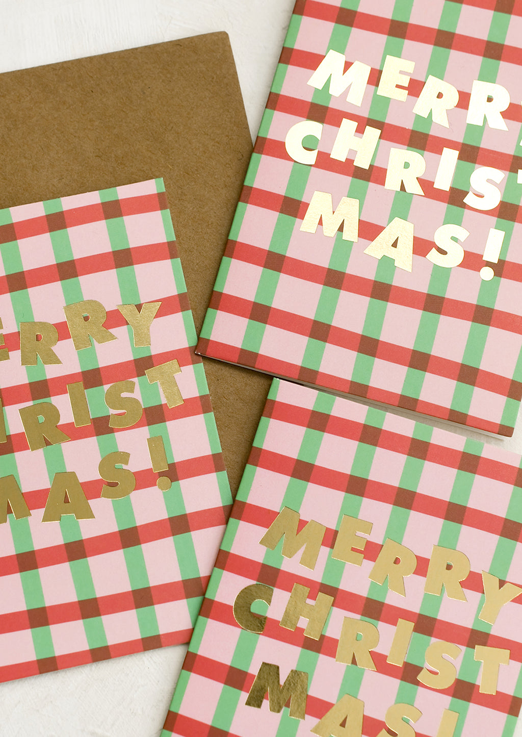1: A set of red and green plaid Christmas cards.